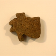 Udjat eye amulet made of lightgreen-brow faience